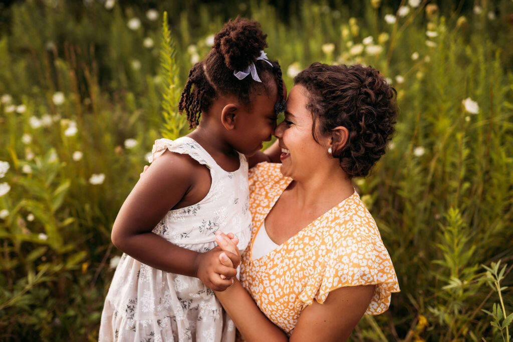 Woman nose-to-nose with young girl